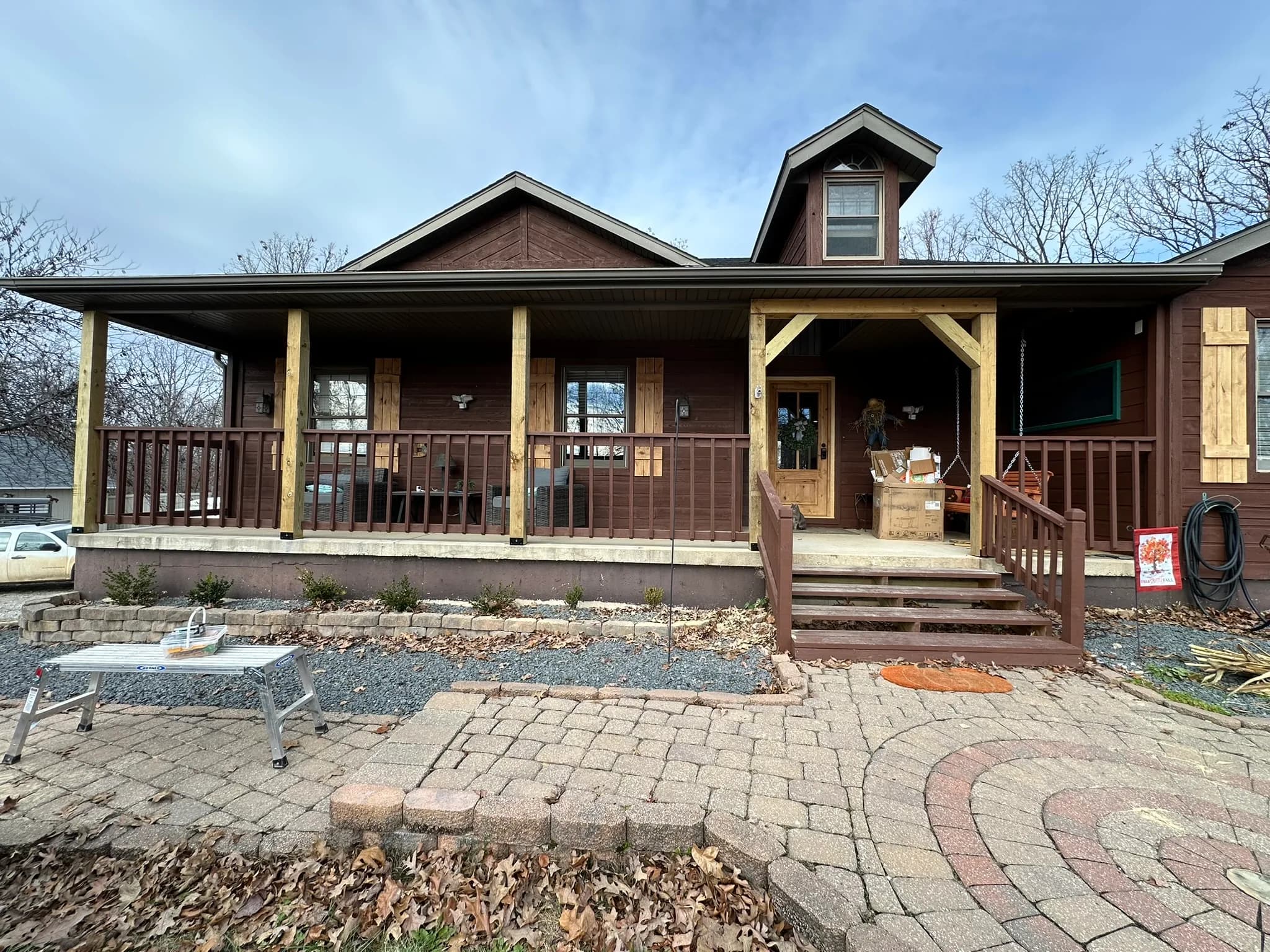 Finished front porch deck and stairs with custom wood railing