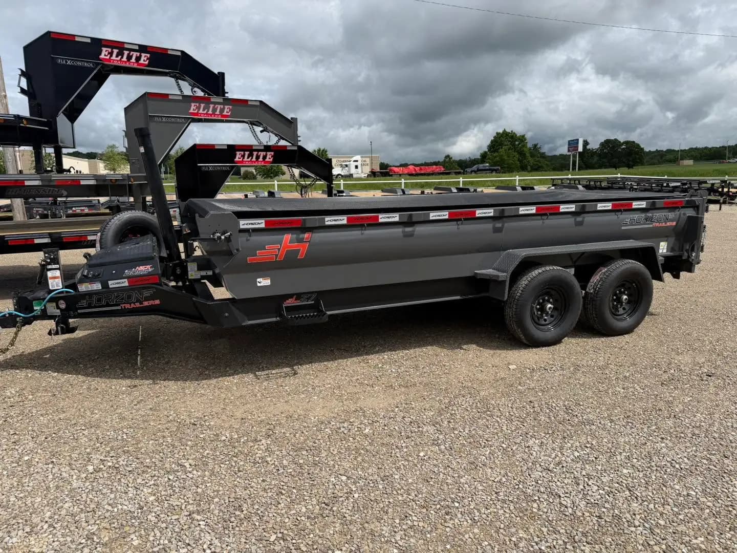 Black dump trailer ready for gravel and debris hauling