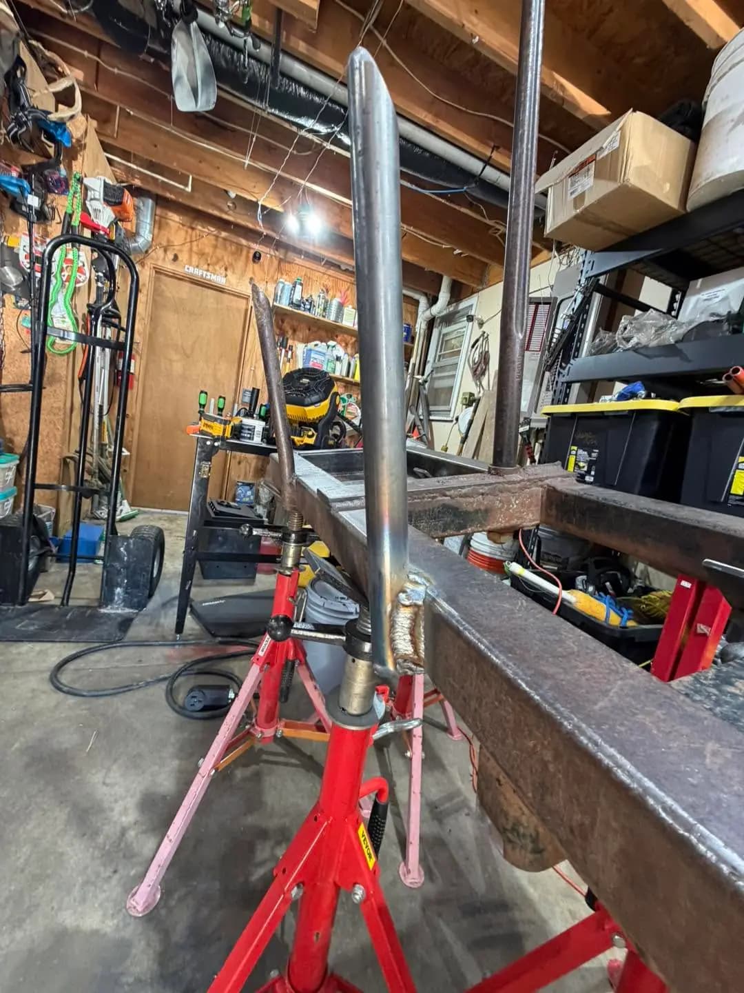 Welded hay bale spear attachment supported in the shop