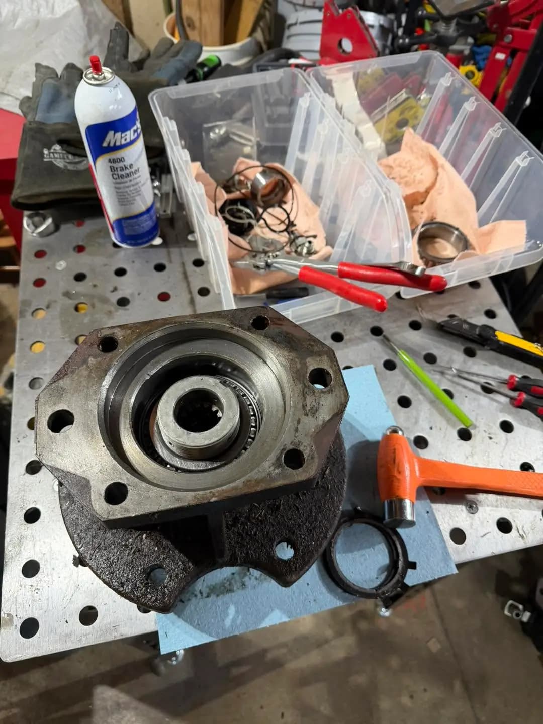 Disassembled hydraulic pump housing during equipment repair