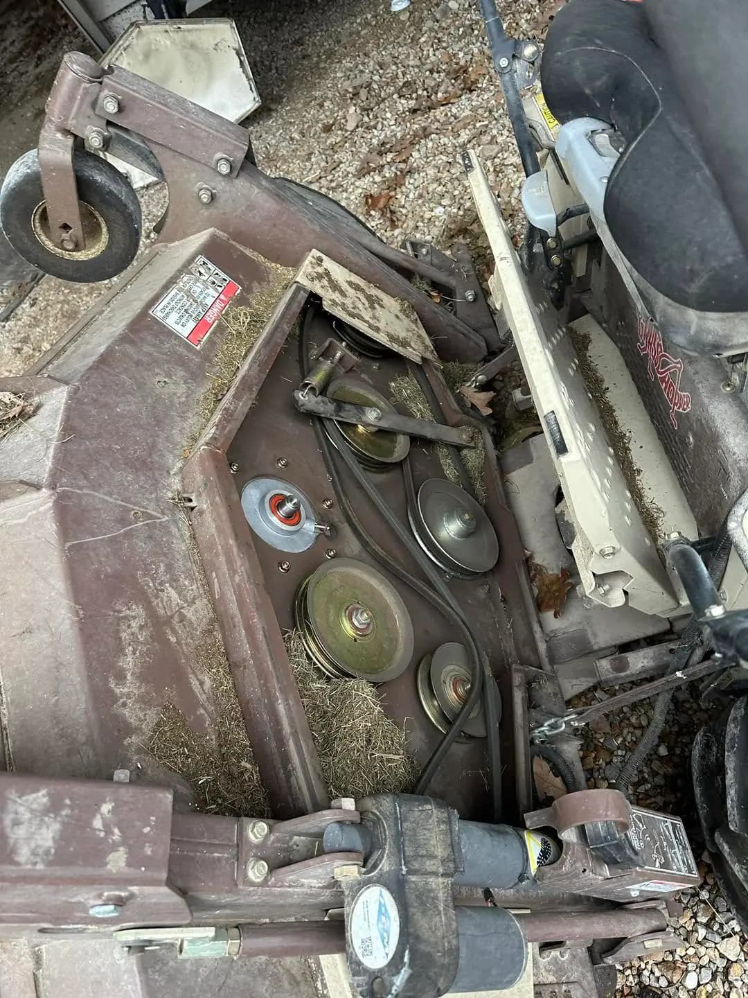 Mower deck belt and pulley repair on farm equipment
