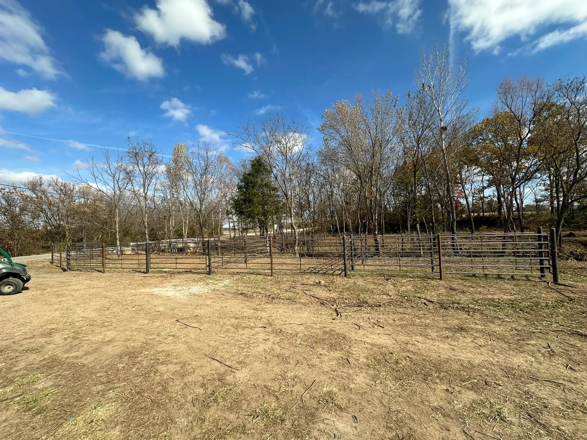 Pipe corral fencing around a dry lot near Lebanon, MO