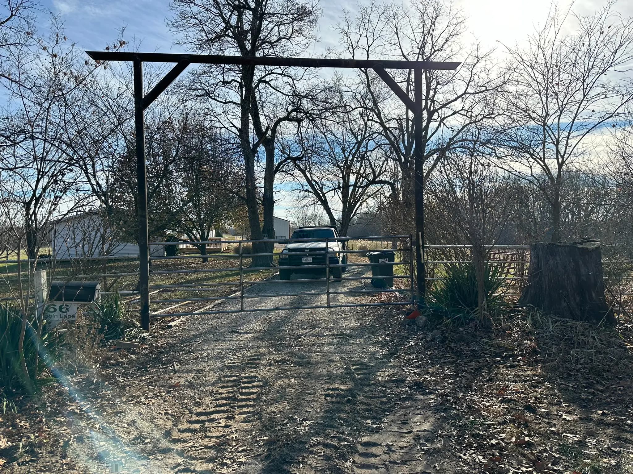 Tall pipe entrance frame with farm gate below