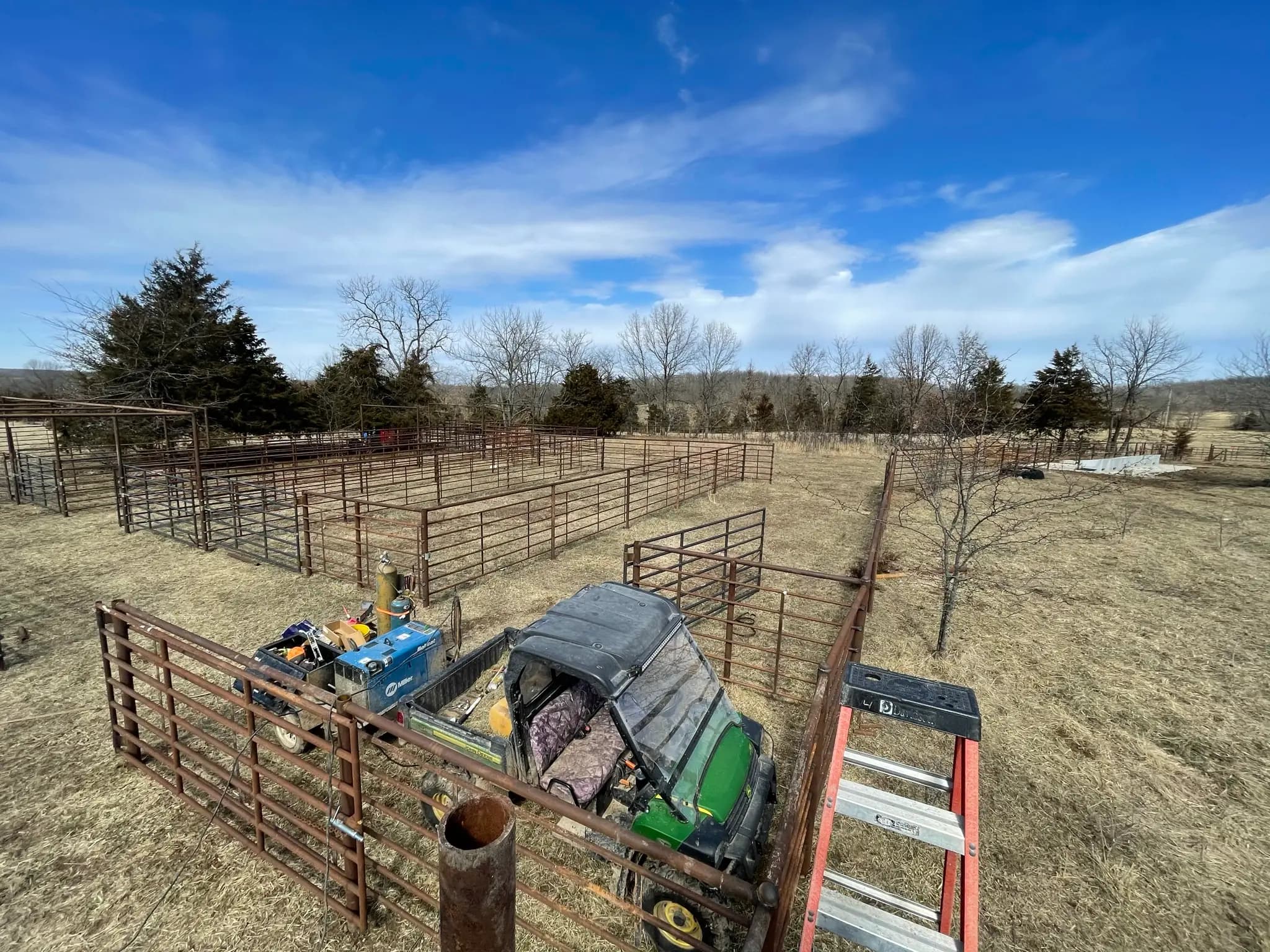 Overhead view of farm corral panels and welding truck
