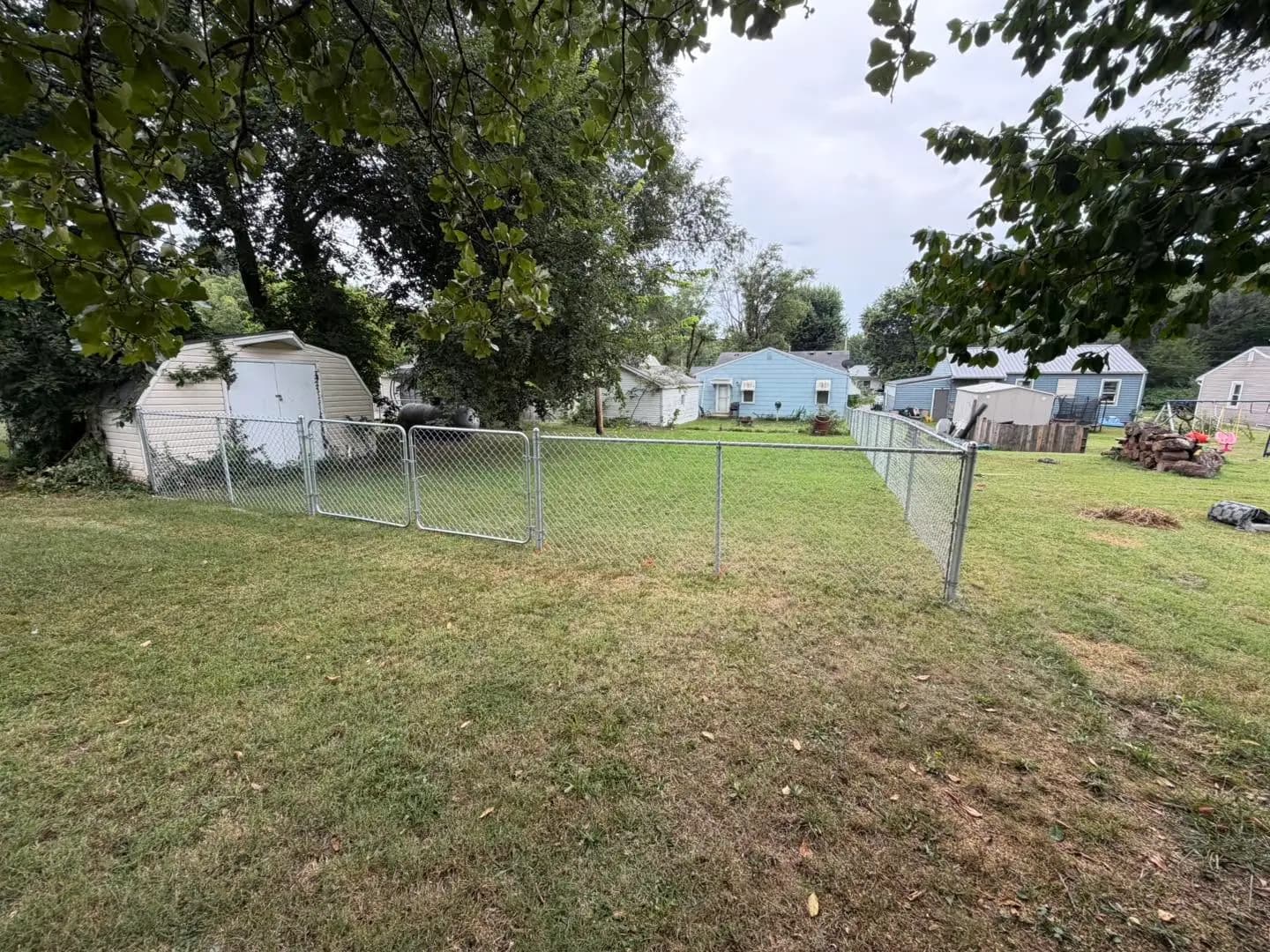 Chain link fence enclosing a residential yard near Lebanon, MO