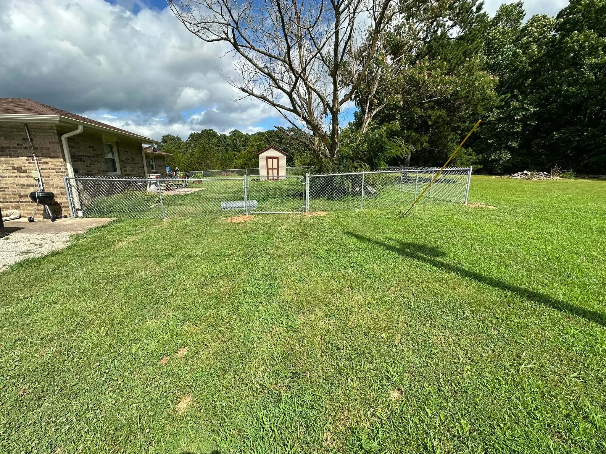 Chain link fence around a residential backyard