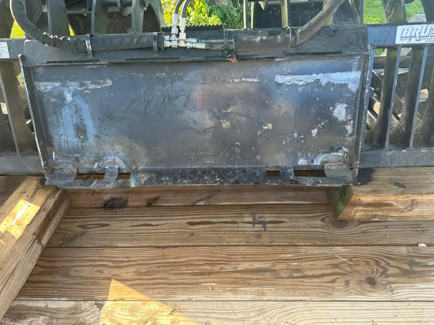 Skid steer attachment plate repair before welding