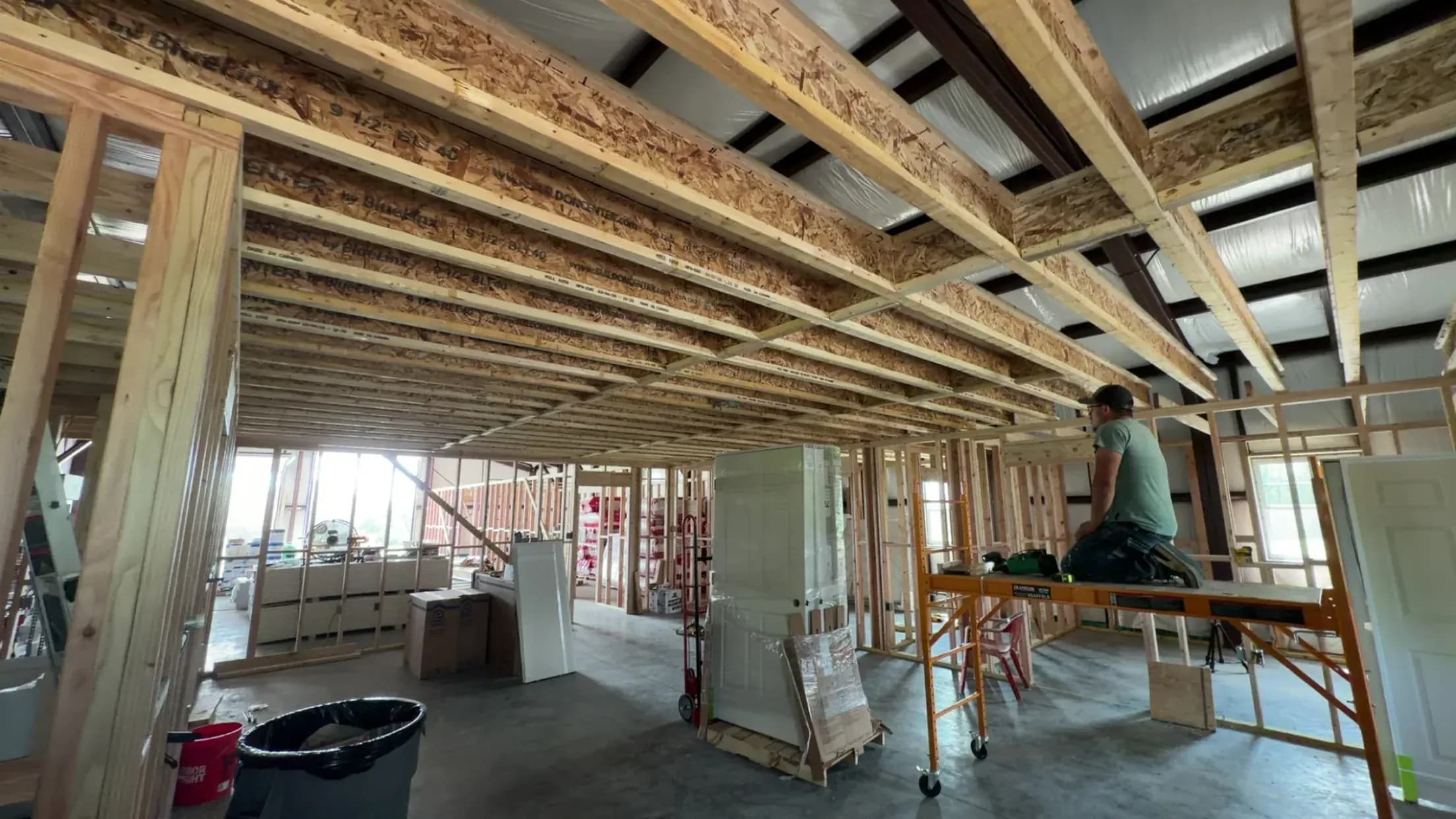 Interior framing and ceiling joists during a home addition remodel