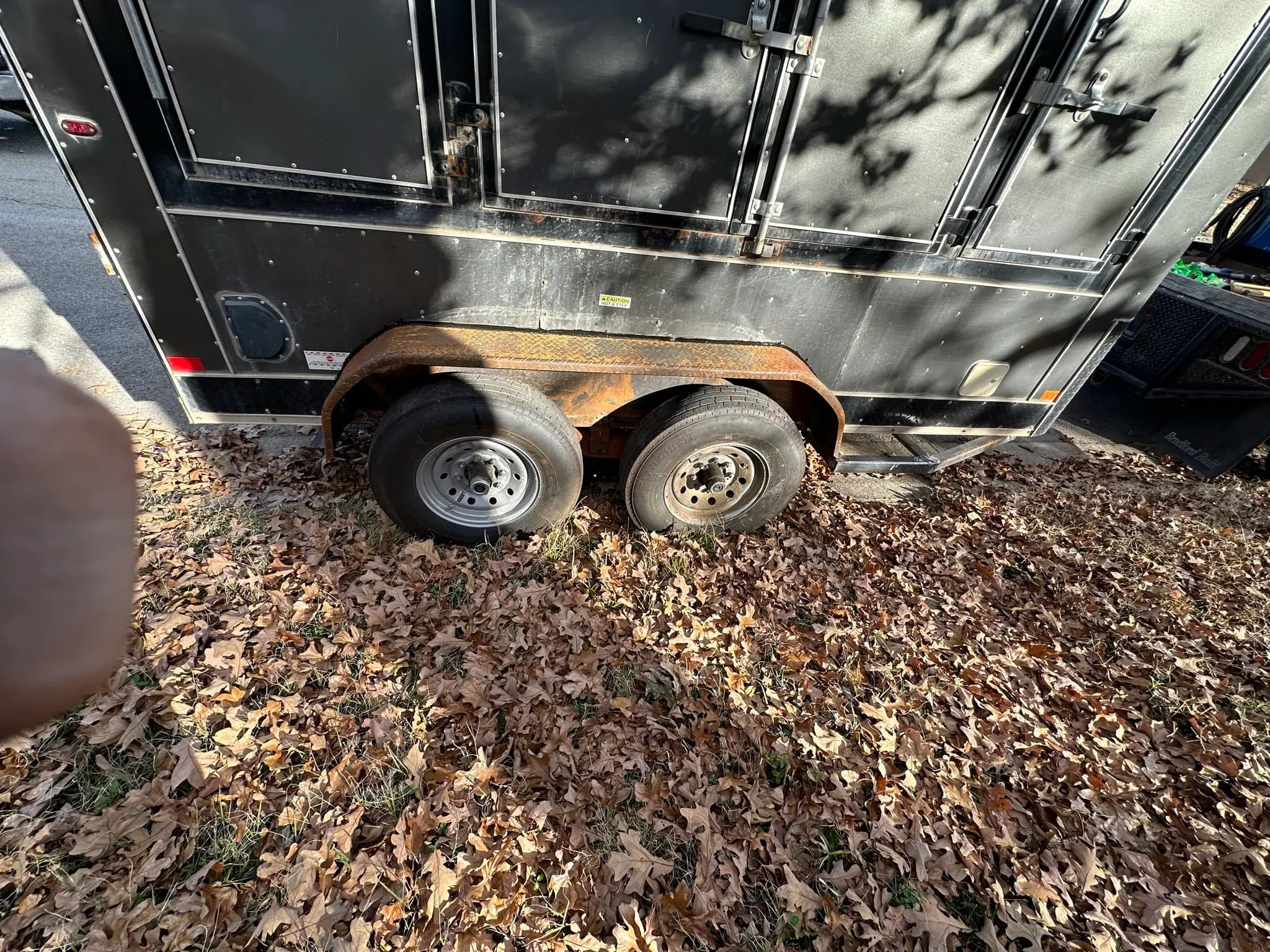 Black trailer fender and frame repair before welding