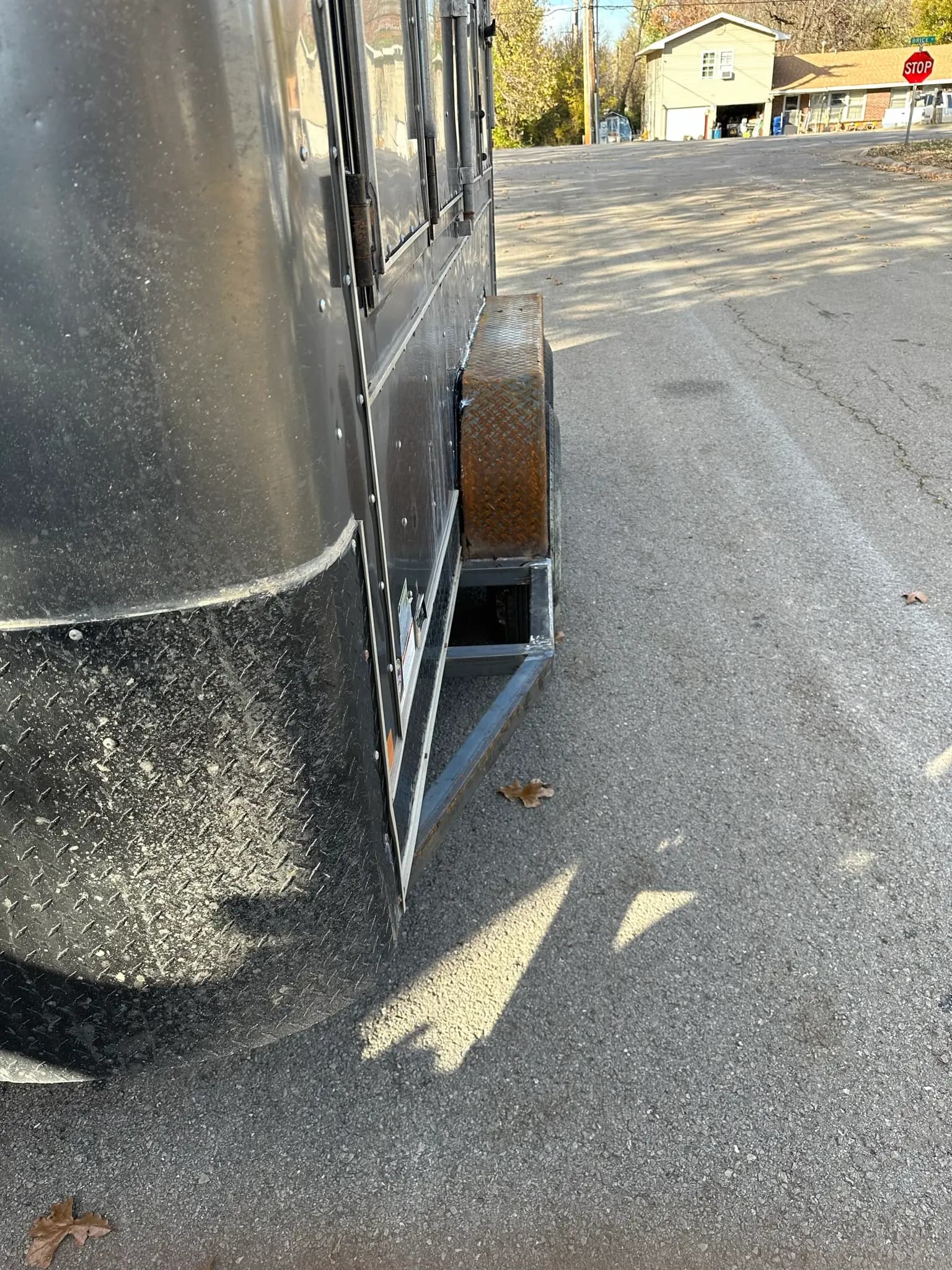 Trailer step and metal bracket repair beside the road